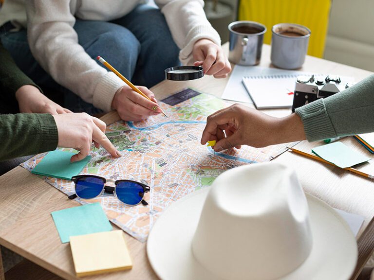 group planning a trip with a map