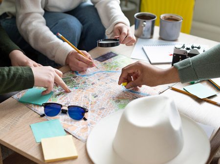 group planning a trip with a map