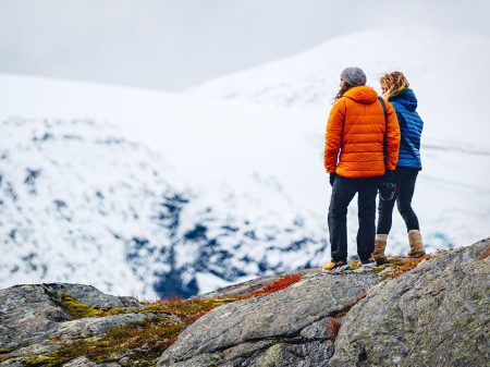 Two women walking on the top of a mountain